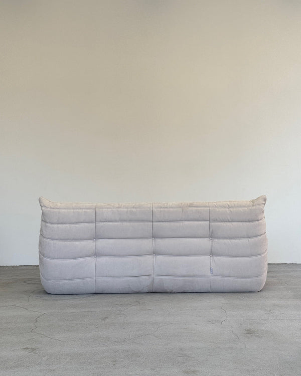 A gray Ligne Roset Togo sofa with a minimalist design 